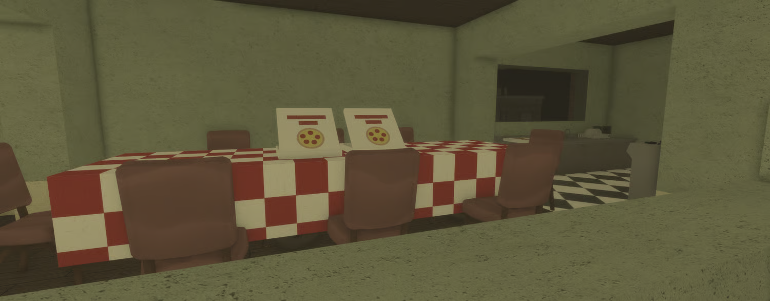 Dining room with checkered tablecloth and chairs