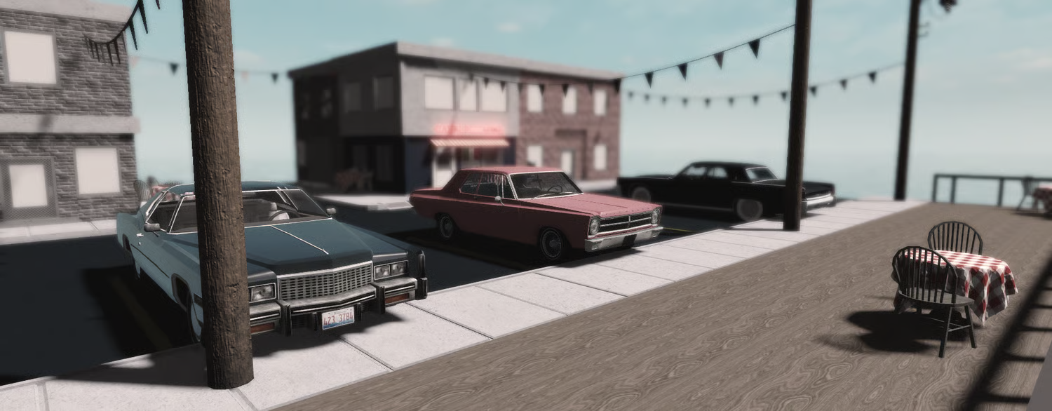 Coastal pizzeria exterior with three vintage cars parked outside