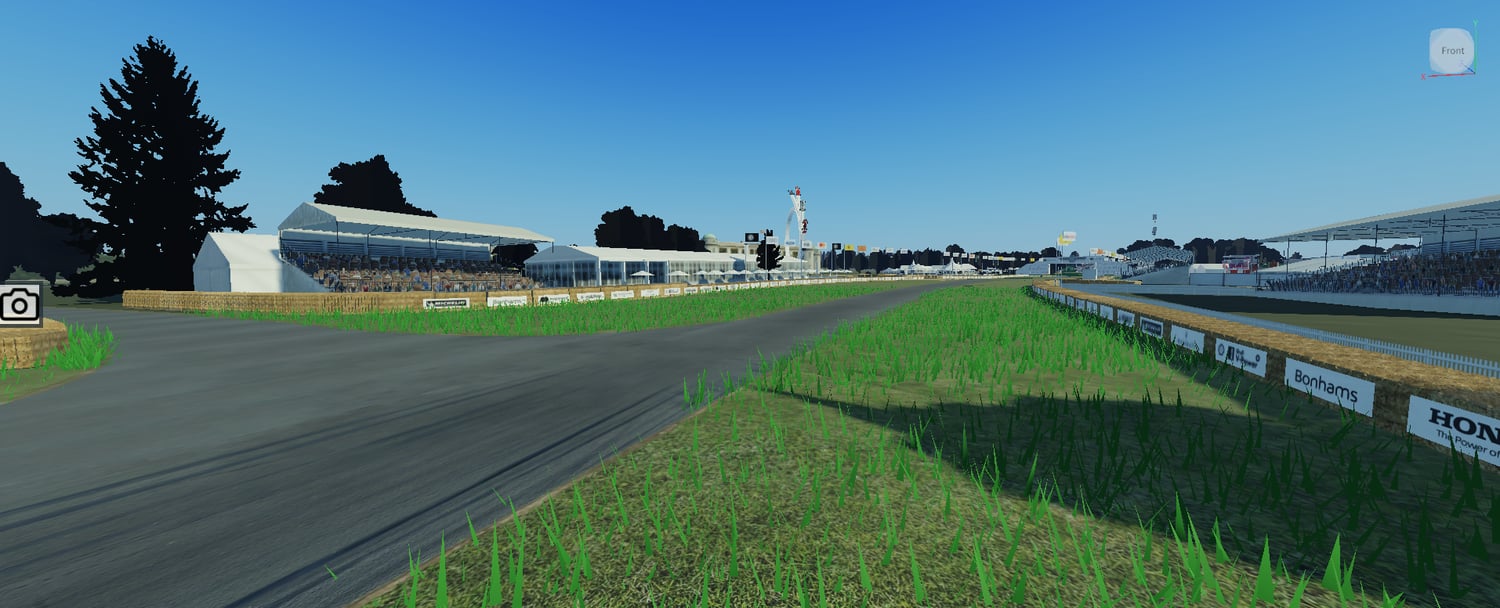 Large racing circuit with grandstands and trackside barriers