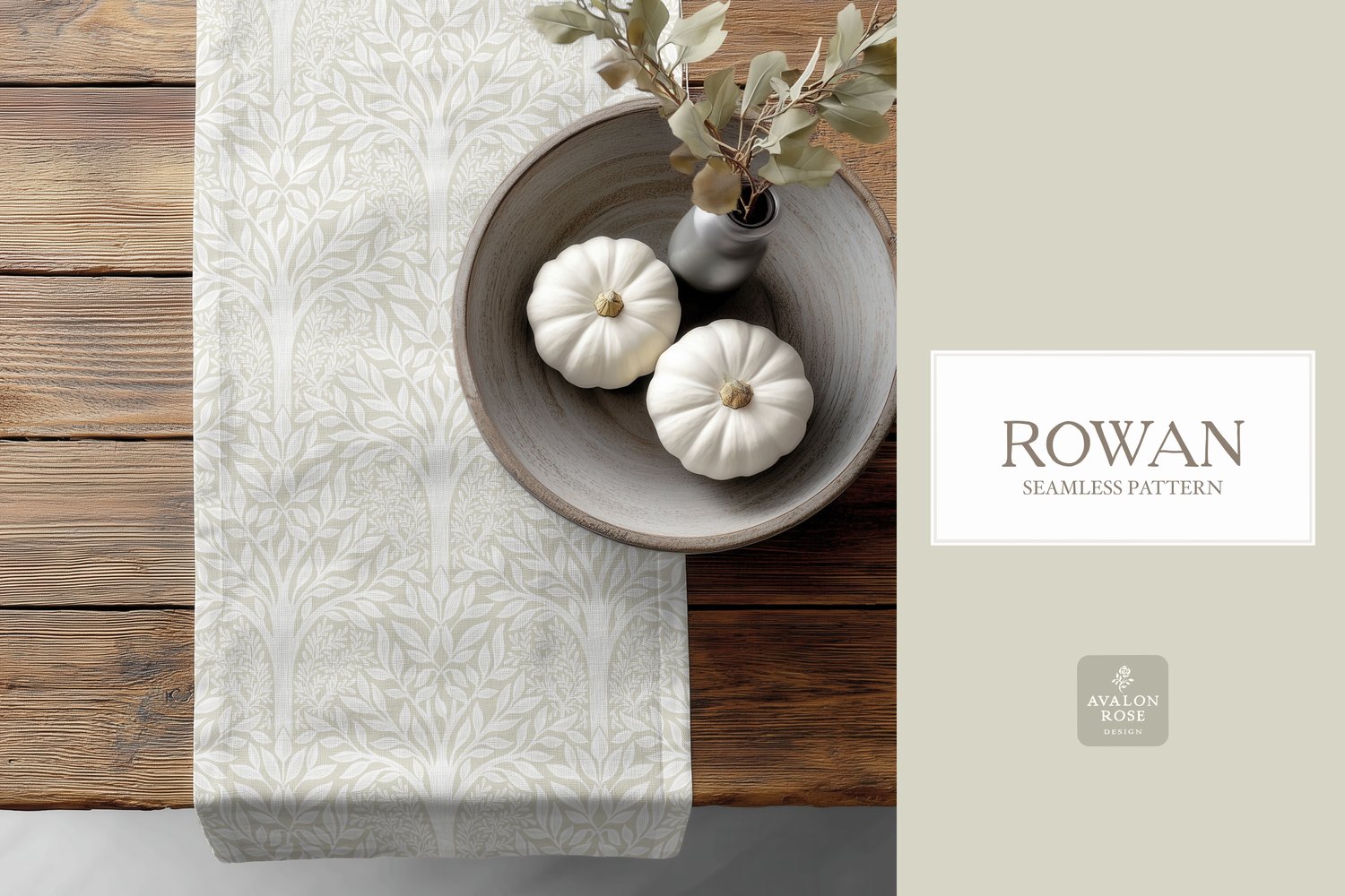 Hand drawn seamless pattern featuring woodland trees and leaves in cream and white on a table runner next to a bowl of white pumpkins