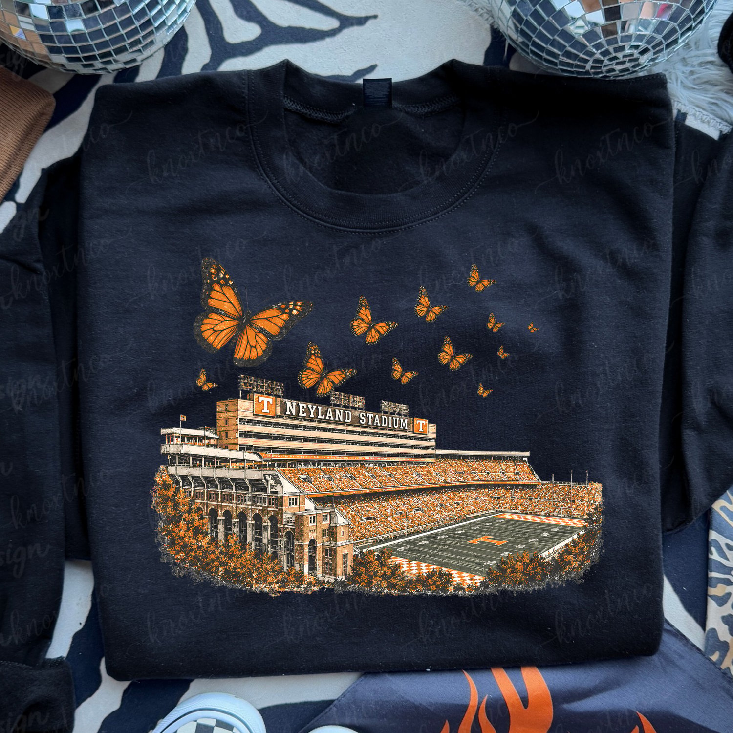 Neyland Stadium Tennessee shirt with Dolly-inspired orange monarch butterflies, Knoxville football game day graphic on a black Gildan t-shirt or sweatshirt.