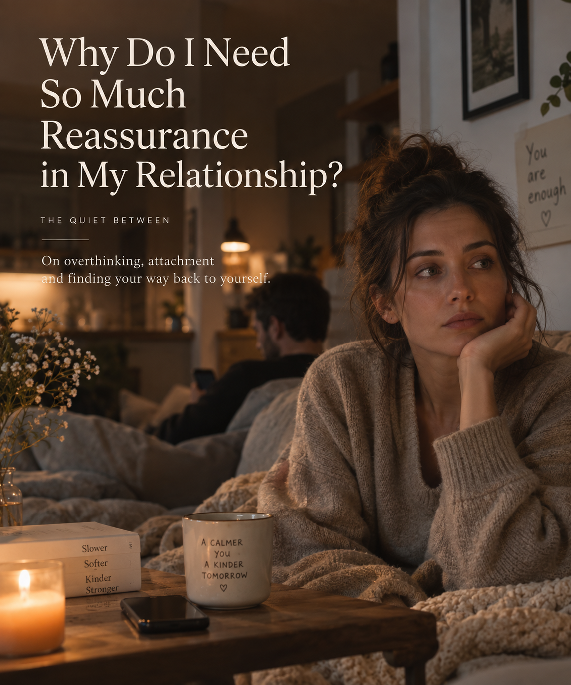 Woman sitting thoughtfully on a couch while her partner is nearby, reflecting on the need for reassurance and emotional safety in a relationship.