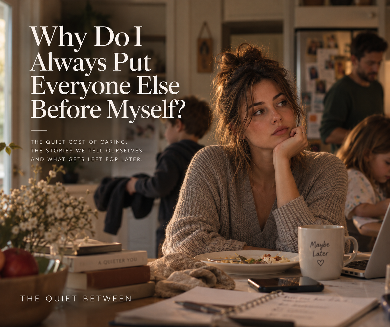 Woman sitting at a kitchen table while her family moves around her, reflecting on the habit of putting everyone else’s needs before her own.