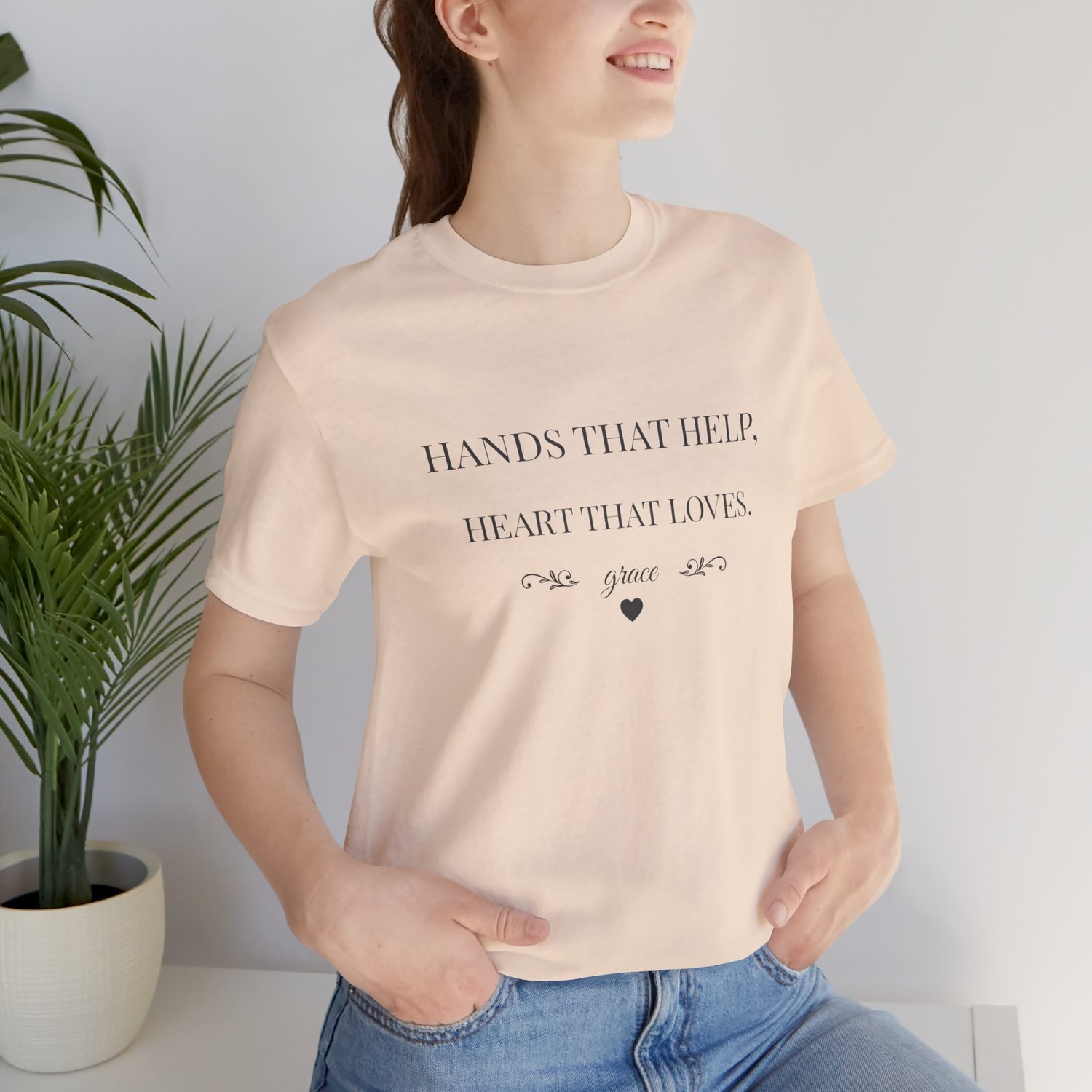 Caregiver shirt Hands That Help Heart That Loves modeled in Soft Cream