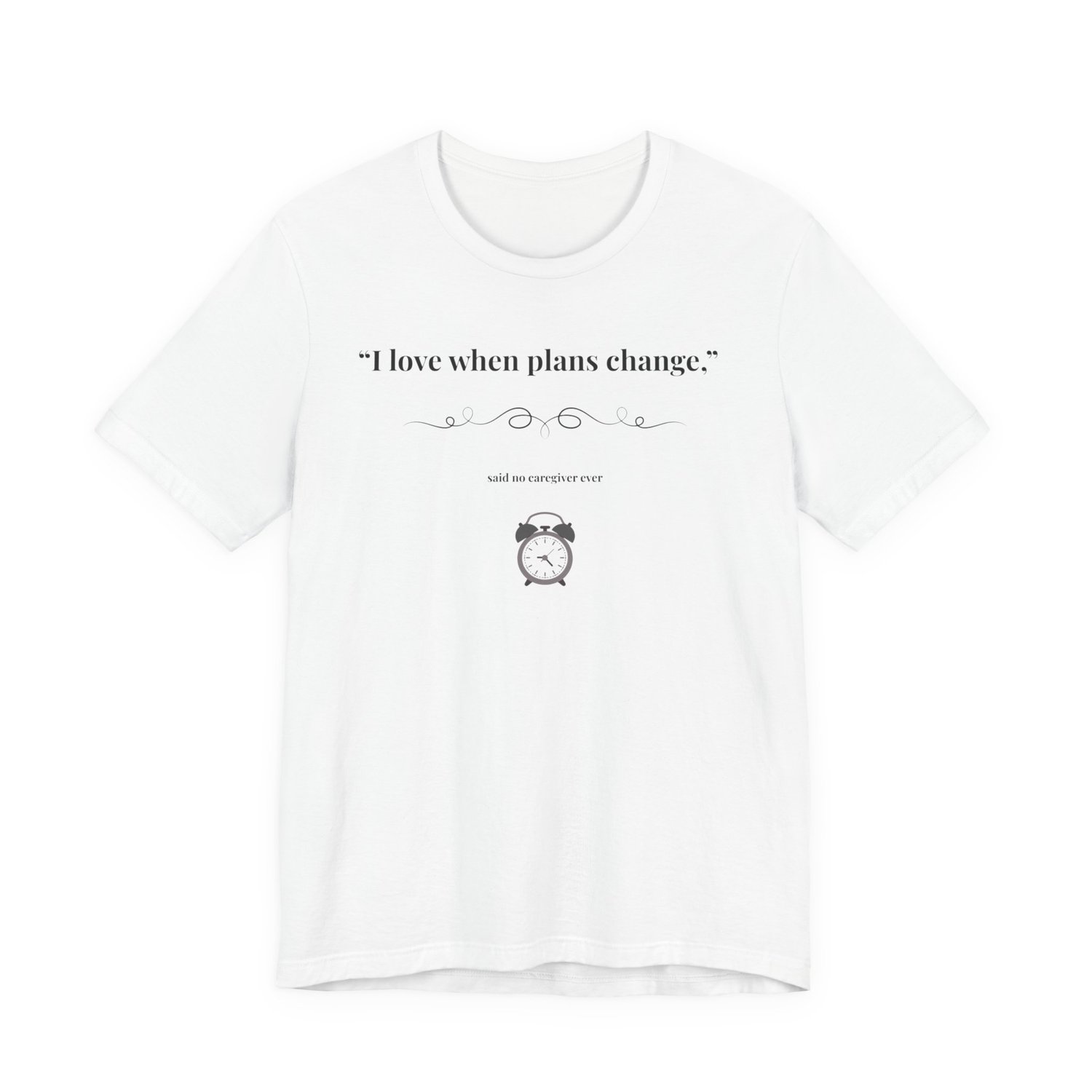 White shirt flat lay – “I Love When Plans Change” caregiver design.