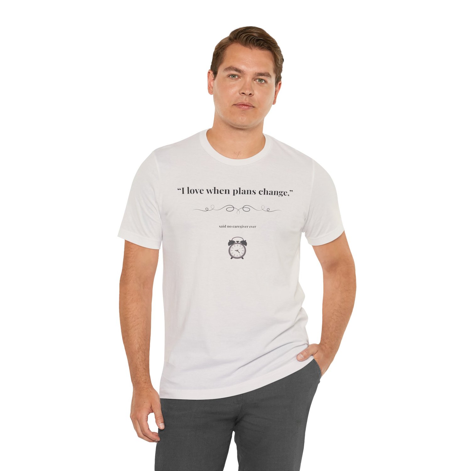 Man wearing White caregiver tee with “I Love When Plans Change” design.