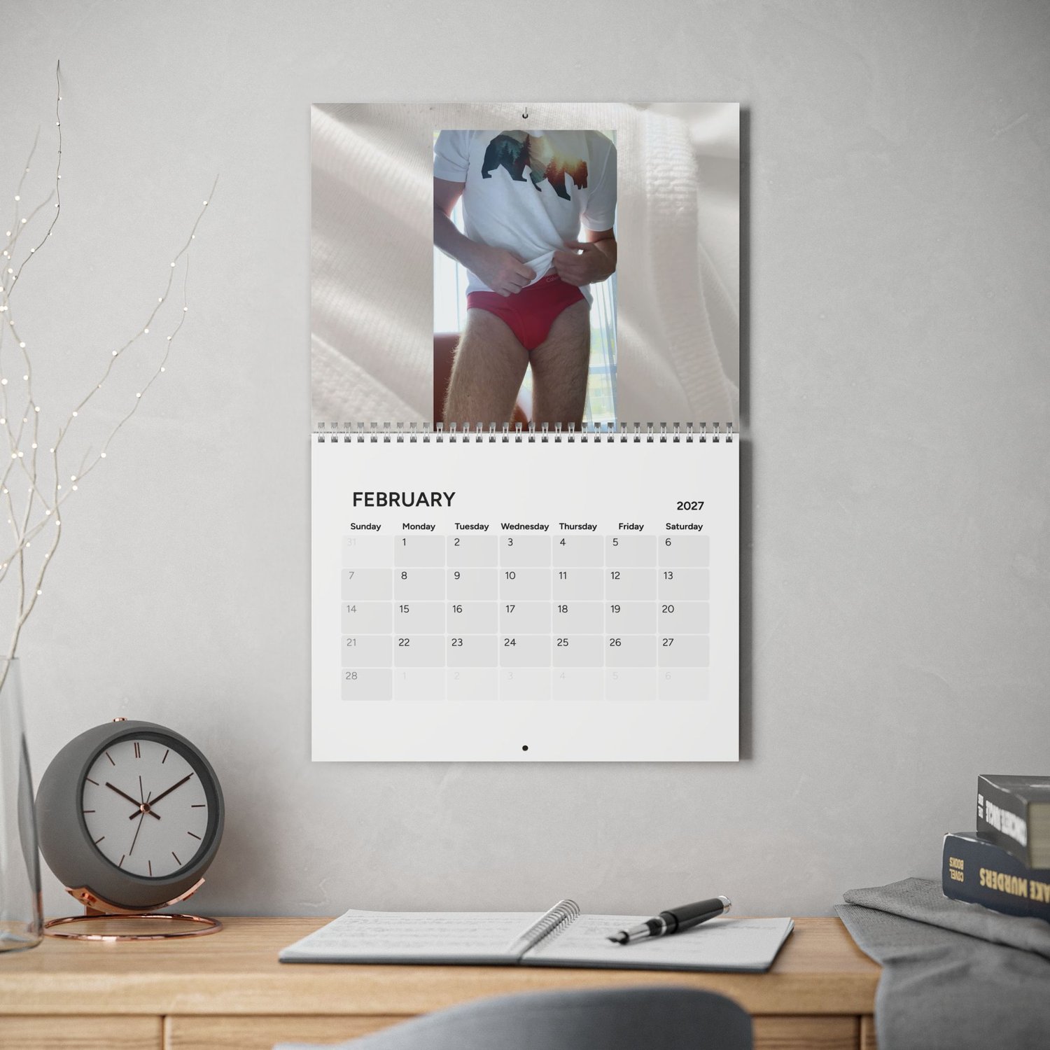 PRiCE / 2027 photography wall calendar displayed in an interior