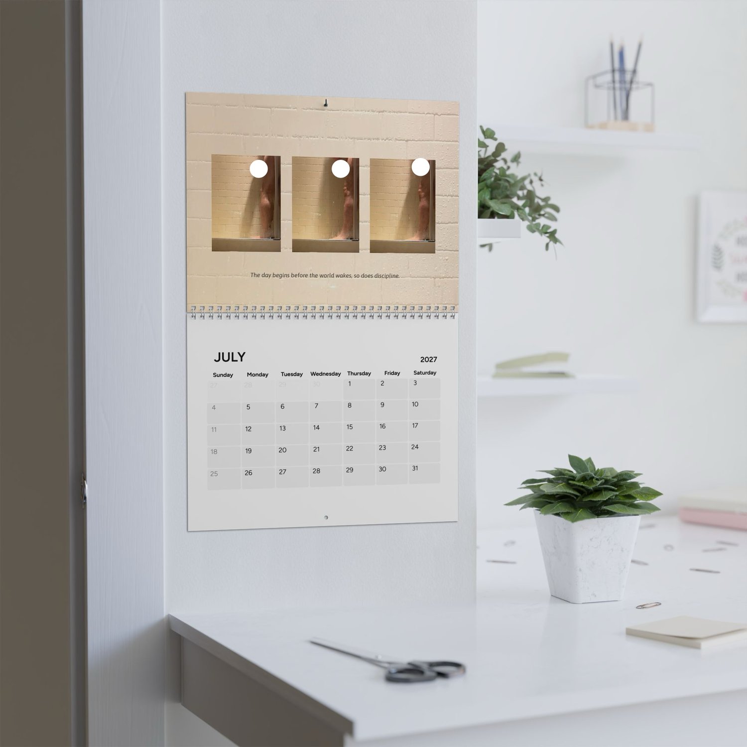 PRiCE SHOWER / 2027 photography wall calendar displayed in an interior
