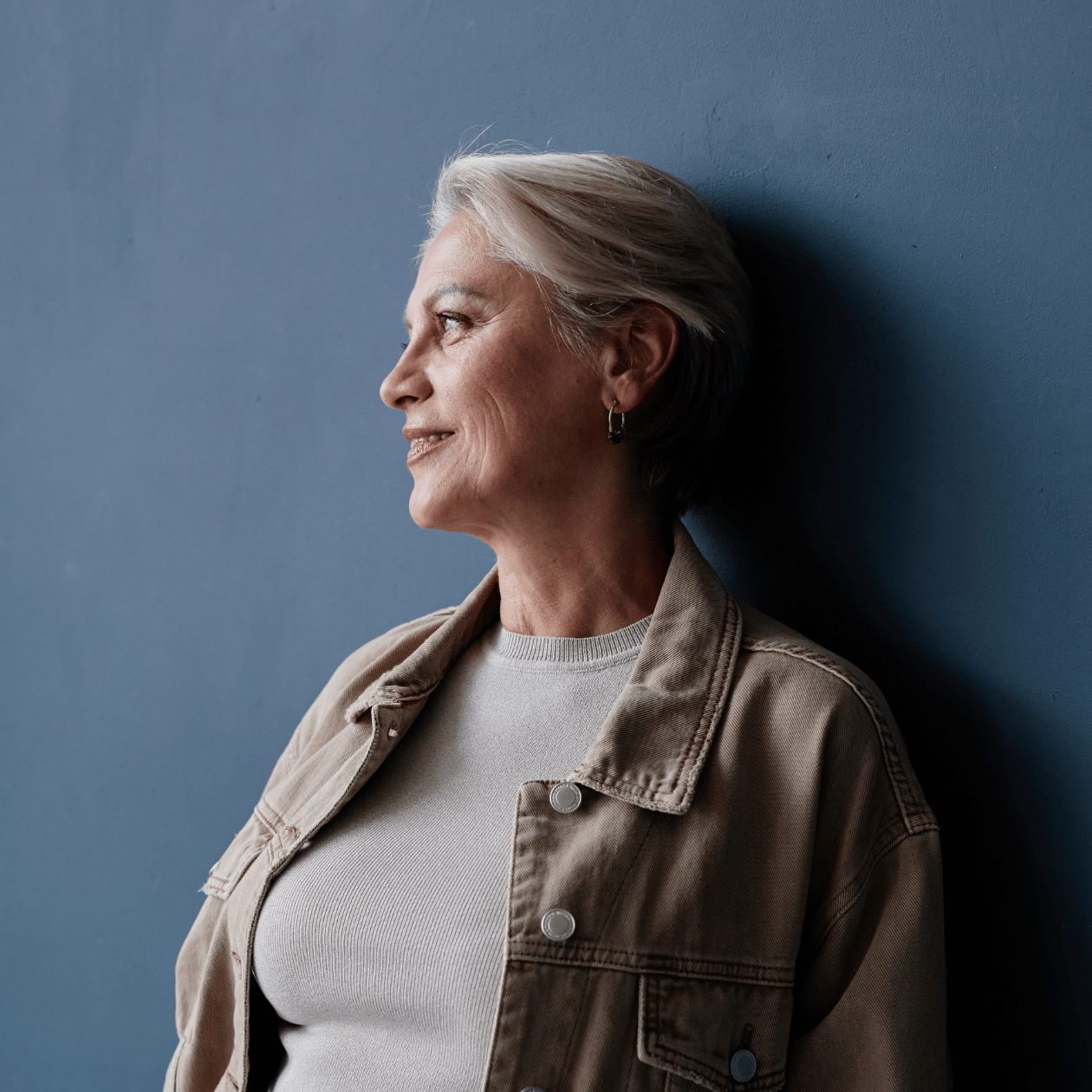 Midlife woman looking thoughtful