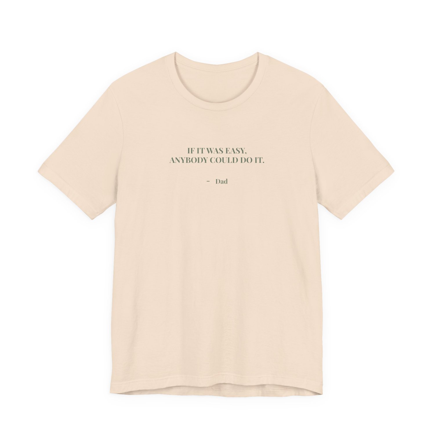 Cream t‑shirt with the quote ‘If it was easy, anybody could do it. — Dad’ displayed on the front.”