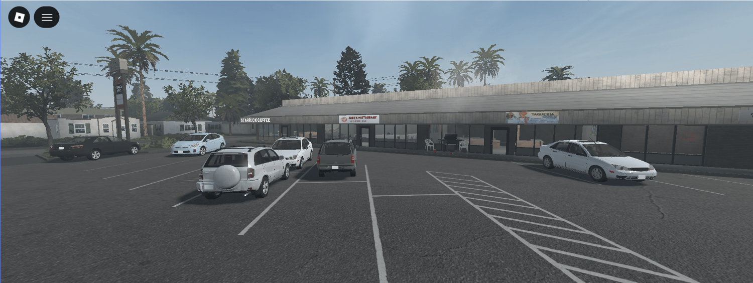 Commercial storefronts and detailed parked vehicles