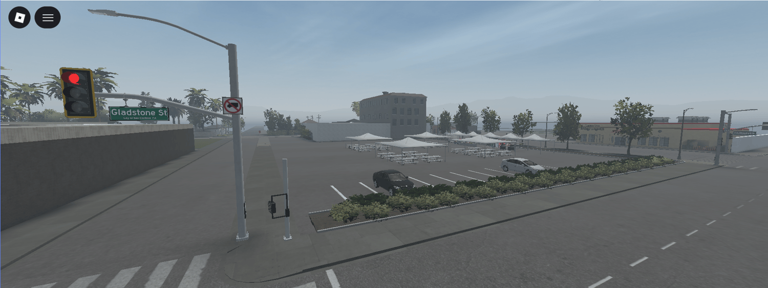 Large parking lot beside city buildings and landscaping