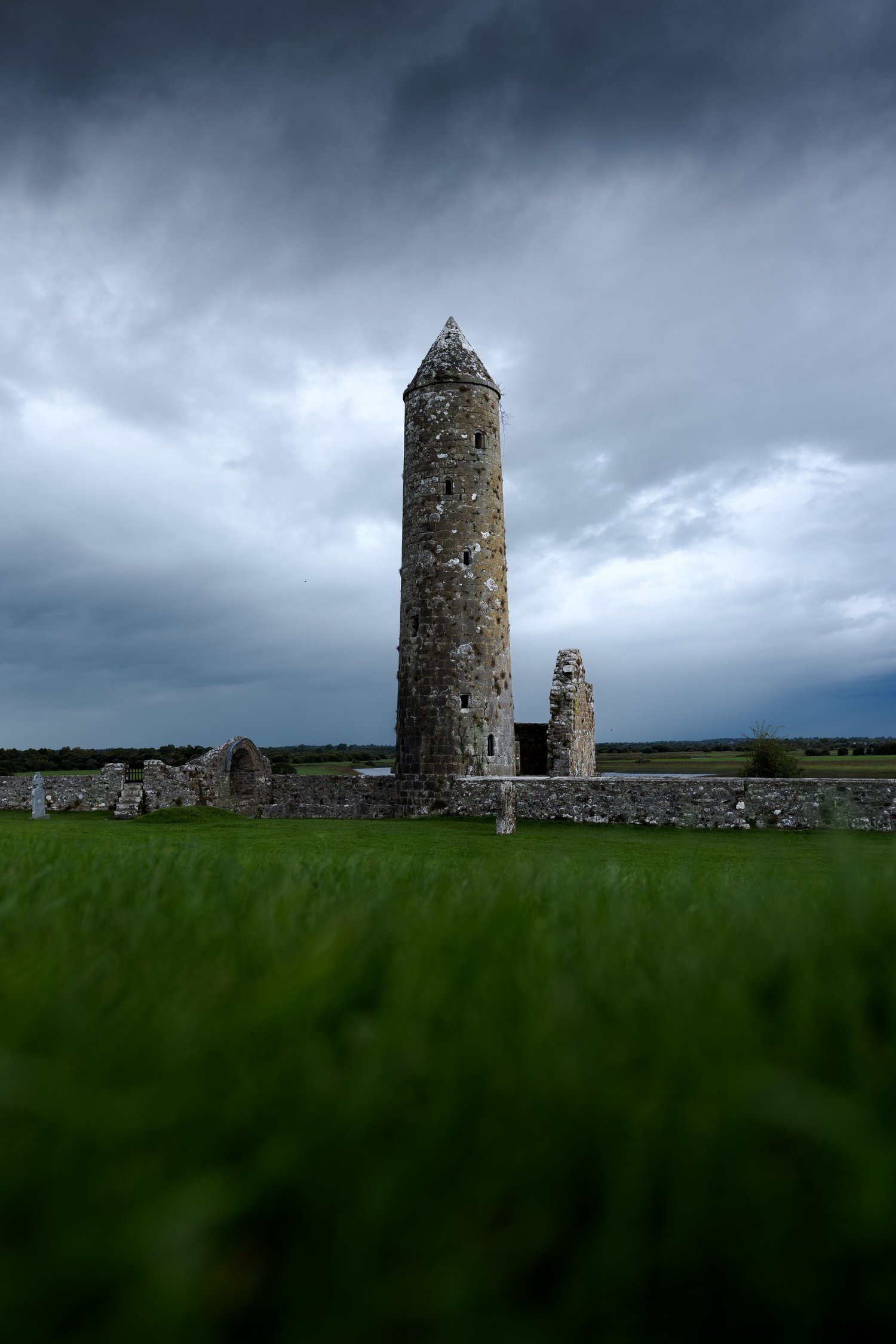 Ireland Clonmacnoise Monastic Site round irish abbey tower moody landscape photography_1
