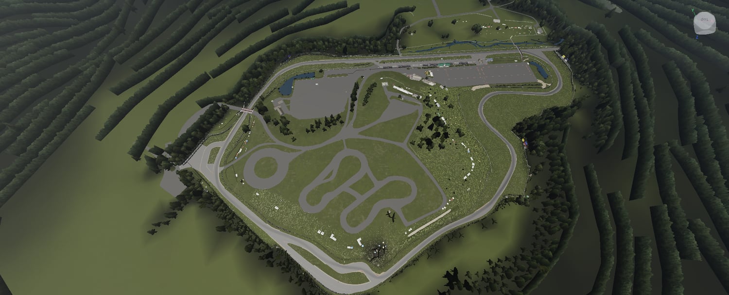 Pond beside the circuit and surrounding guardrails