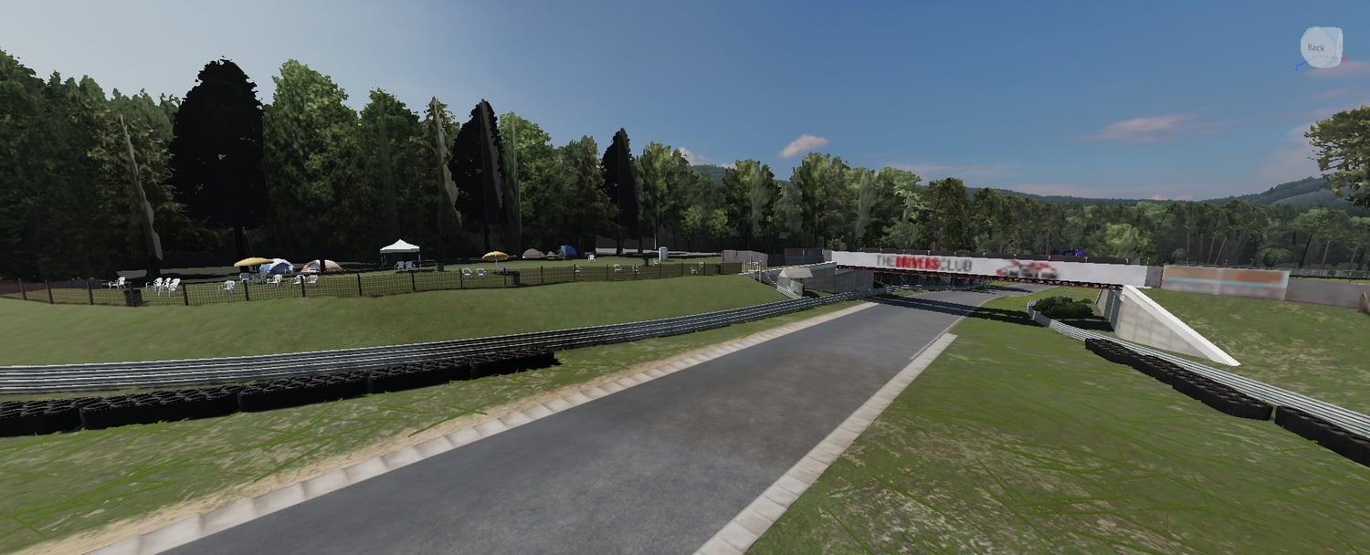 Forest-lined circuit with trackside advertising boards