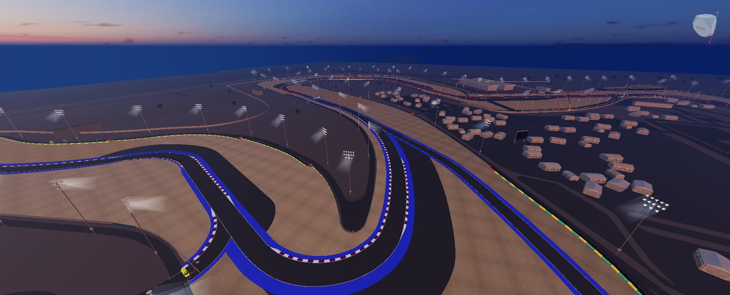 Elevated view of asphalt bends and blue track markings