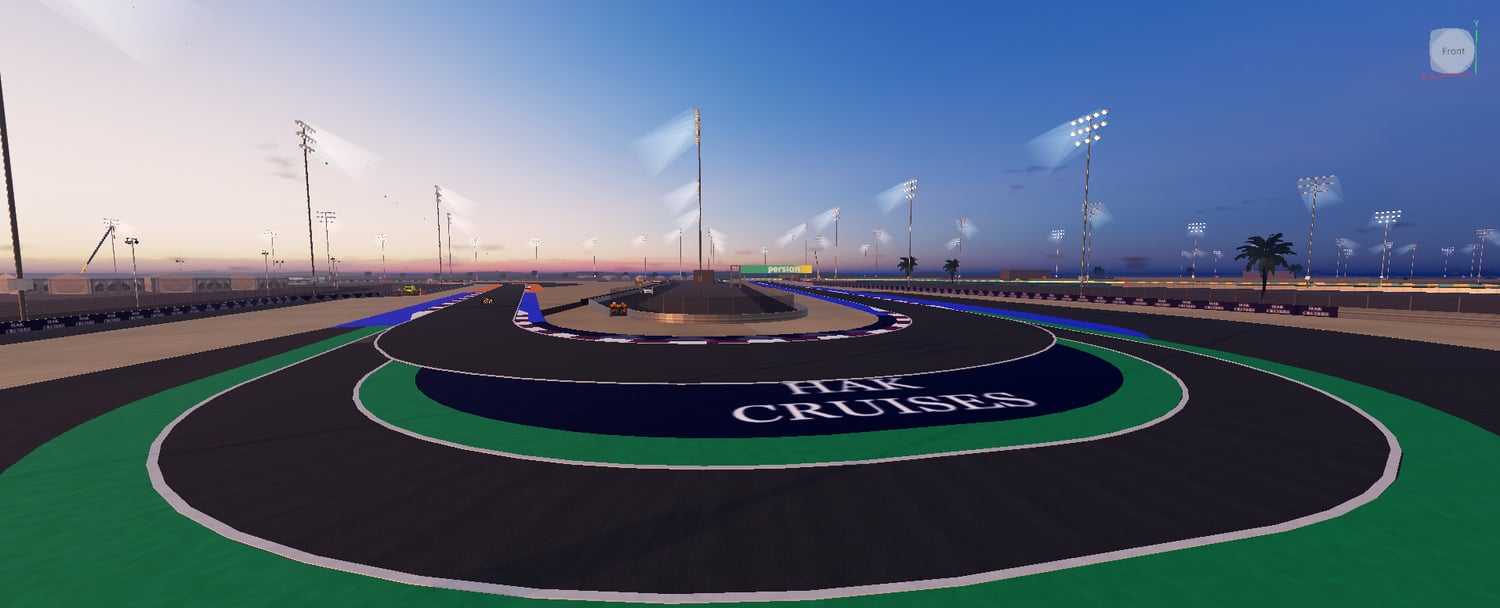 Circuit grandstands beside an orange runoff section