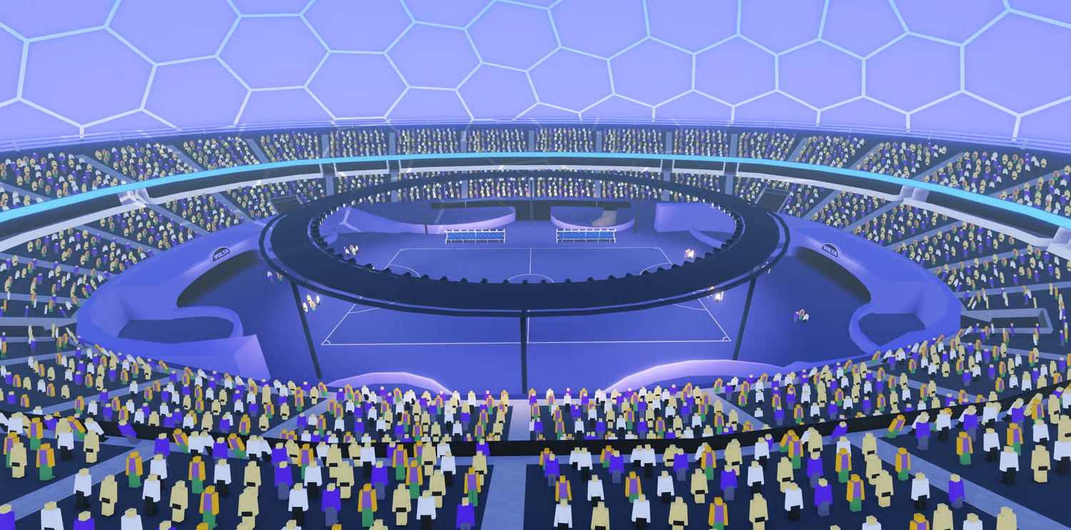Large football field surrounded by colorful spectator stands