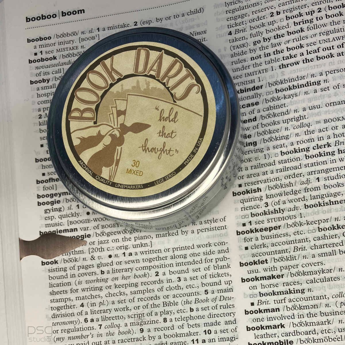 book dart tin, shown on a dictionary page