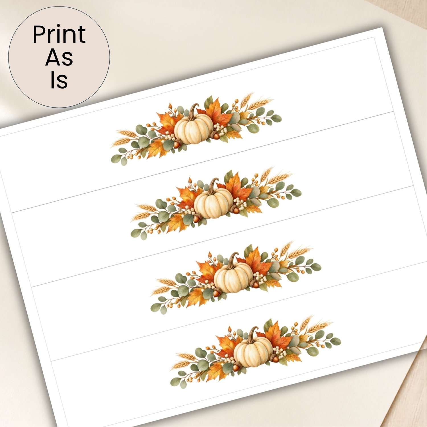 Printable Thanksgiving napkin rings featuring watercolor white pumpkins, orange autumn leaves, eucalyptus, wheat and acorns, with four bands on a US Letter page.