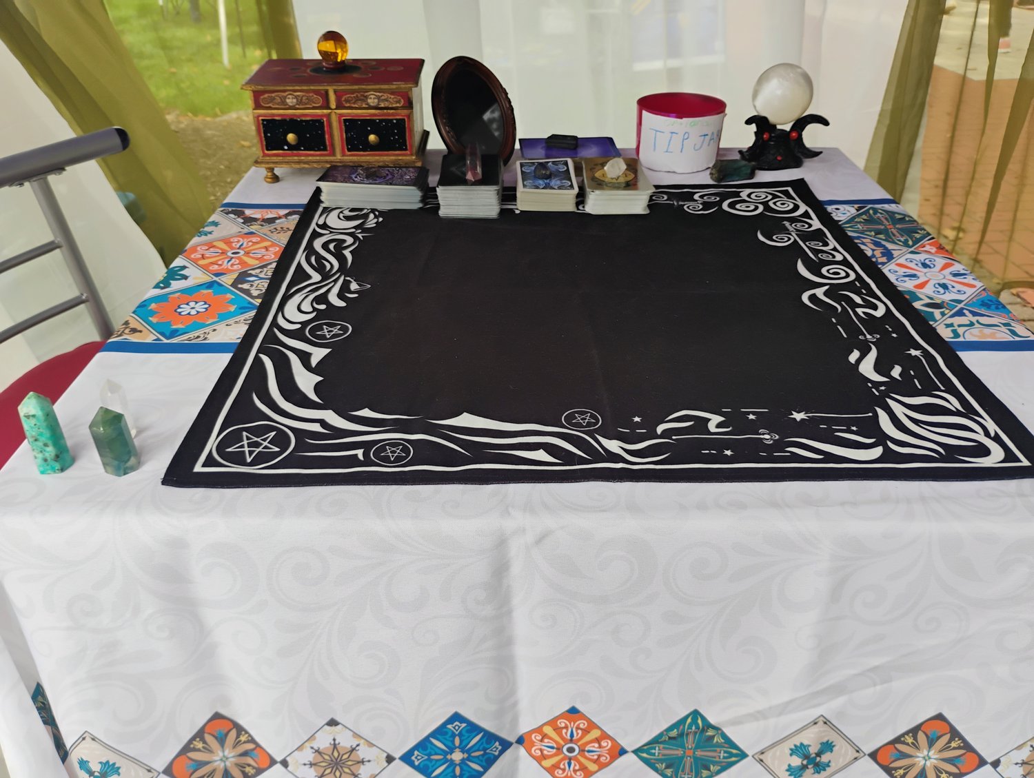 Photograph of the Tarot reading table inside Evylyn Rose's booth at the 2025 Newark Community Day in Delaware