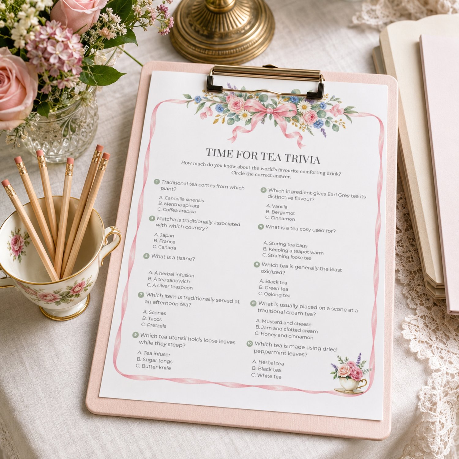 Printable Garden Tea Party Trivia Game with 10 multiple-choice tea questions, watercolor pink ribbon and English garden flowers, floral teacup and answer sheet.