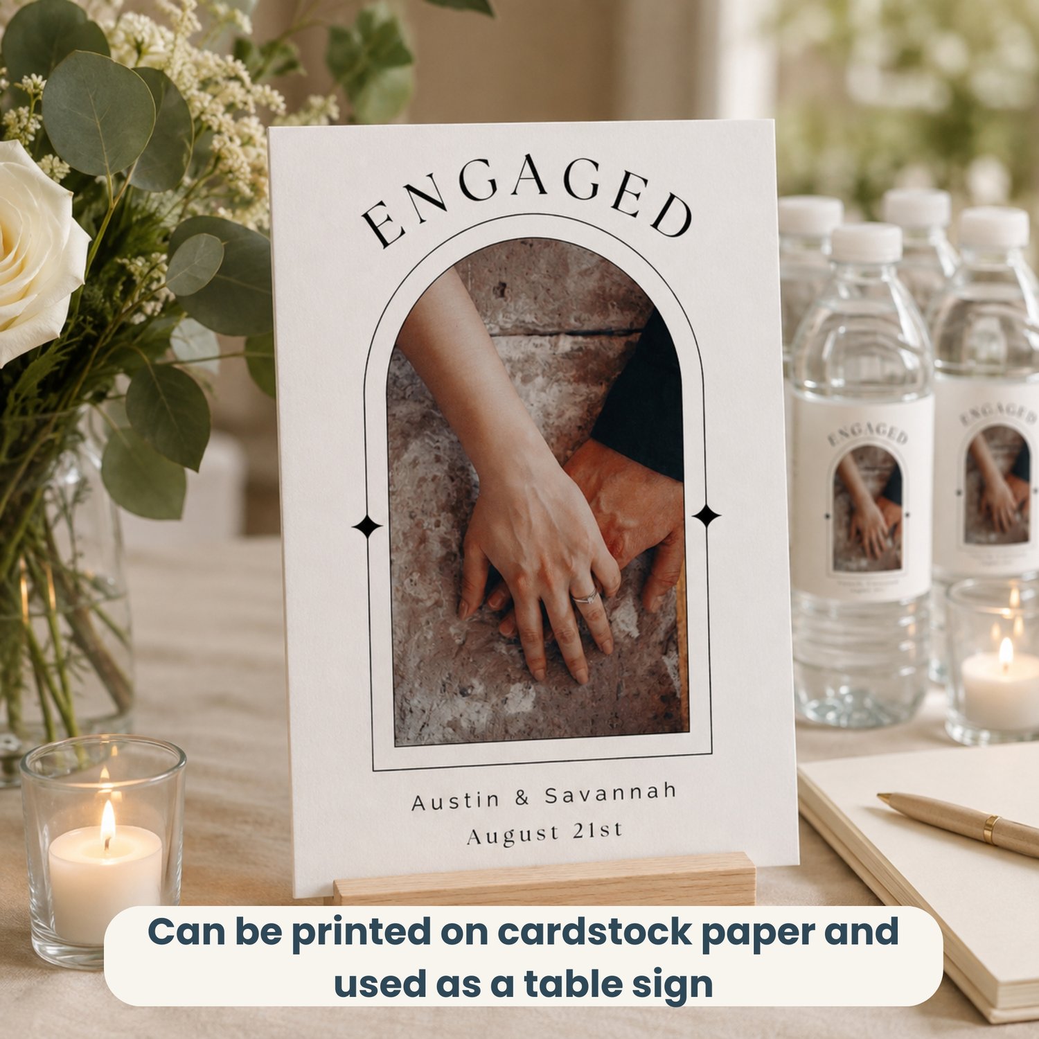 Editable 4 by 6-inch engagement bottle label template featuring a couple’s photo, names and date in a modern black-and-white arched design, with two labels arranged on a letter-size printable sheet.