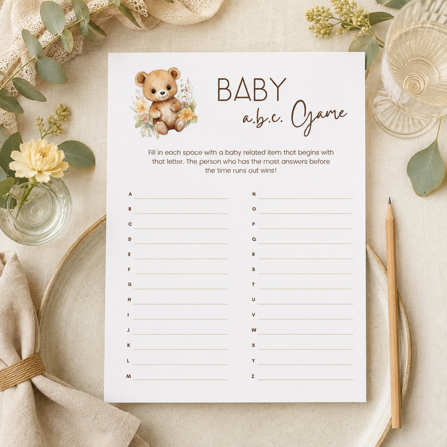 Printable Baby Shower ABC Game featuring a sweet watercolor teddy bear with neutral flowers, simple instructions and A-to-Z answer lines on a US Letter-size page.