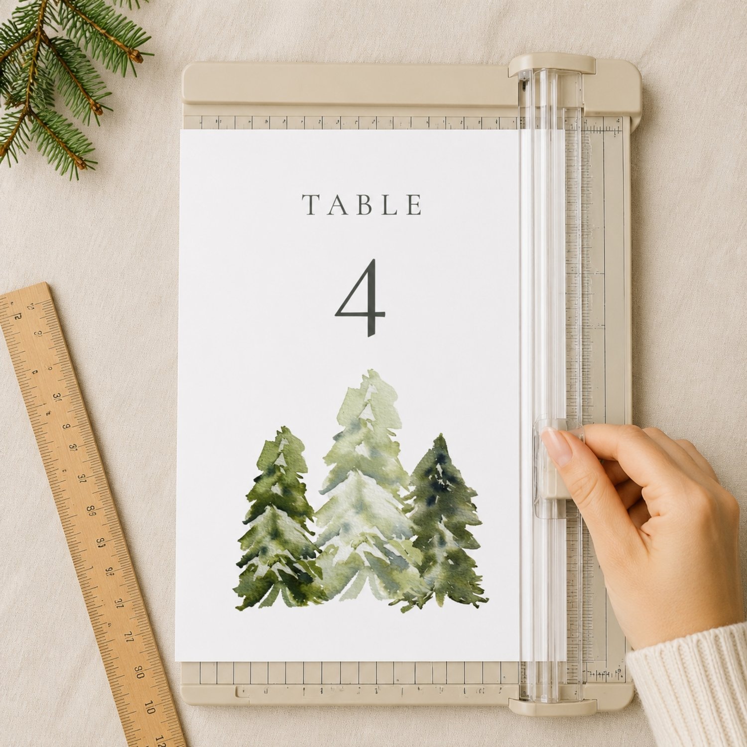 Editable 5 × 7-inch watercolor pine tree table number card featuring soft green woodland trees, elegant charcoal lettering and table numbers 1–30 for rustic, forest, mountain or outdoor weddings.