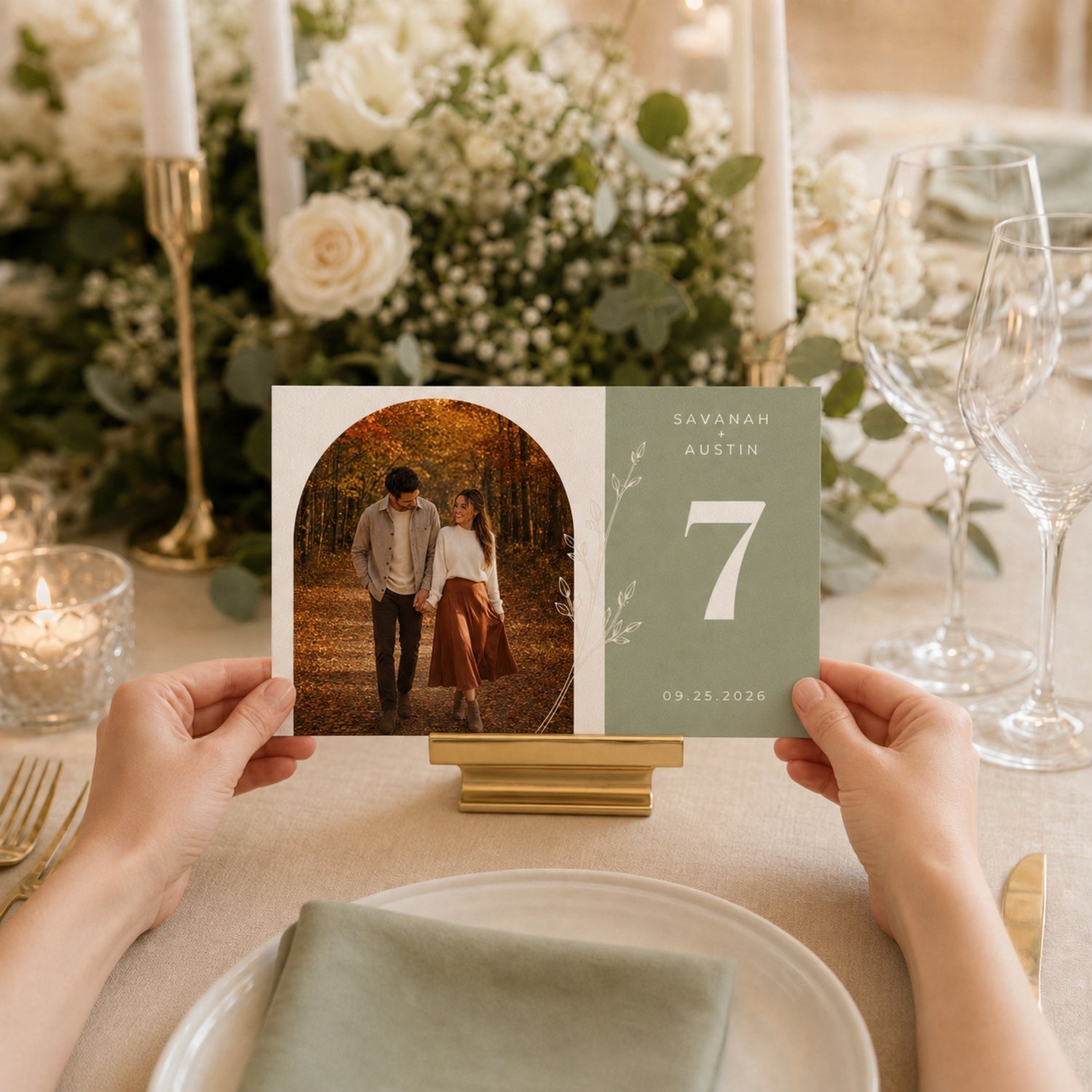 Editable sage green wedding table number card featuring a couple’s photo, white botanical line art, personalized names and date, and a large table number on a 6 × 4-inch horizontal design.