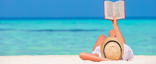 Woman reading on a beach