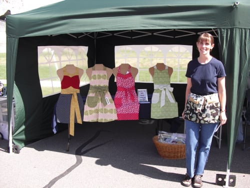 Selling aprons at a local business fair