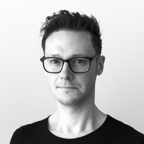 A black and white portrait photograph of Rob Bootle