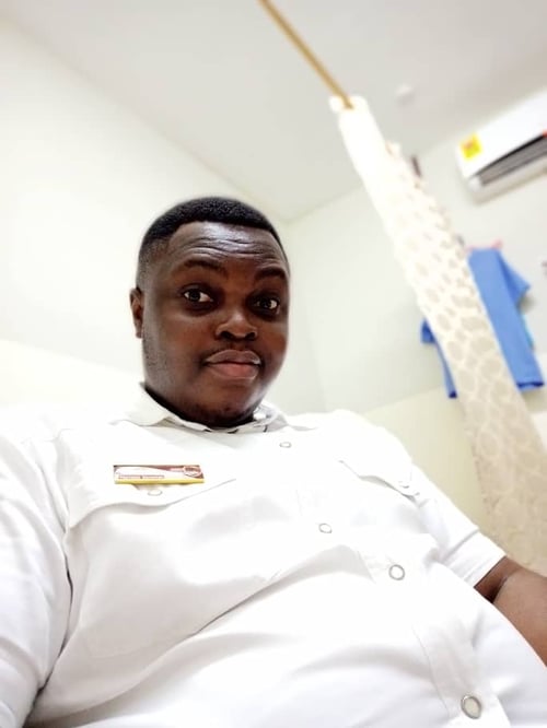 Doctor sitting in his consulting room.