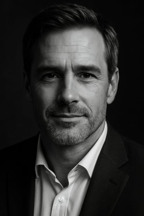 Professional black and white portrait of a confident, trustworthy man in a suit.  A man you'd trust with your money or your secrets.  ideal partner.