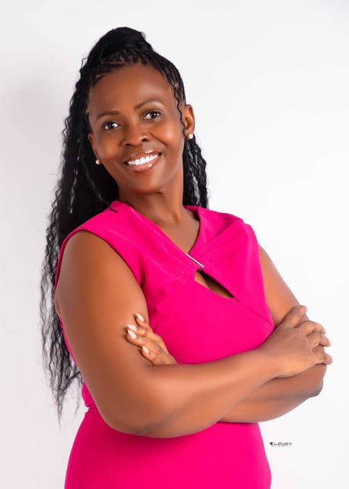 Professional portrait of Sarah Eunice Fayah, smiling in a business outfit - A Virtual Assistant and Entrepreneur based in Ghana offering administrative services, business support and helping small business stay organized and productive.