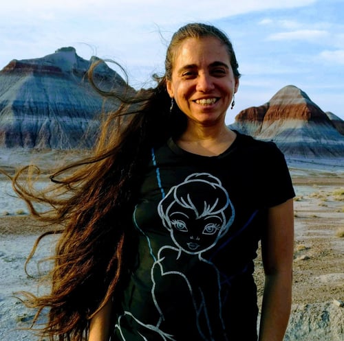 Image of Eve Lovestar (Eve Sanchez) in North Arizona showing a background od desert mountains