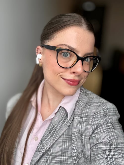 woman in glasses brown hair blue eyes