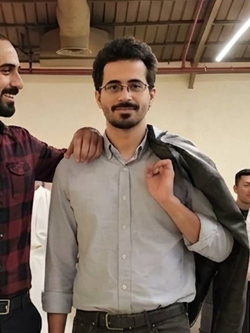 Faris, Founder of Tadween Planner, Wearing light grey shirt