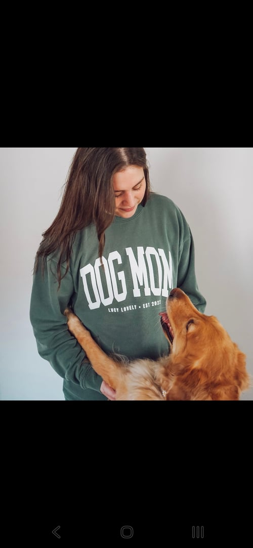 Dog mom sweatshirt outfit with woman holding golden retriever, cozy pet owner lifestyle, dog lover apparel, matching dog mom clothing, trendy pet fashion, gift for dog moms, Chicago dog mom style, pet brand The Pawty Scene, cute dog and owner bonding moment.