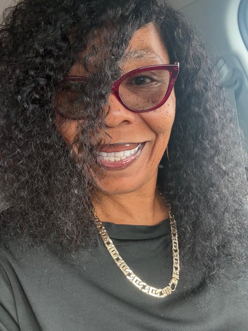 Cherity Reshard, founder of Rebuild Uncut™, entrepreneur, CDL driver, content creator, and legacy builder.