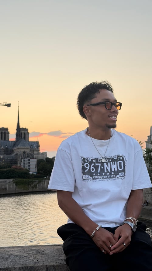 Image of Raazinho posing with the Notre Dame Cathedral in the back