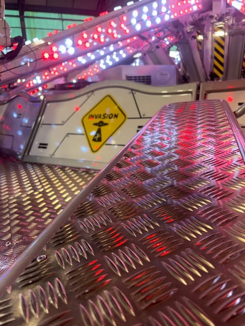 View of invasion fairground ride