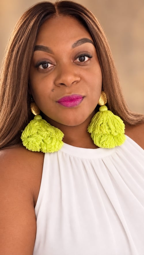 Clear Resource Marketing Group Tiffany Marshall woman's headshot wearing white blouse and lime green earrings