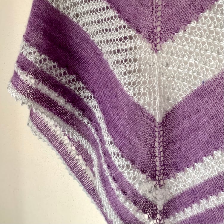 Close up of Shooting Stars shawl. Knitting pattern suitable for using 2 skeins of wool. Best for plain and variegated yarns.