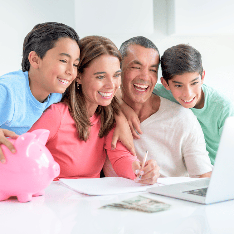 Latino family planning their finances together on a computer