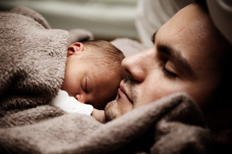 baby and father sound asleep