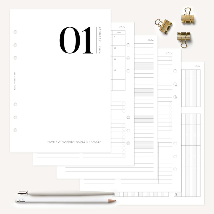 Track goals and review progress with the monthly planner insert
