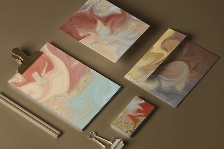 marbled background textures reminiscent of agate or geode stones with glittering gold accents in a wide variety of colors.