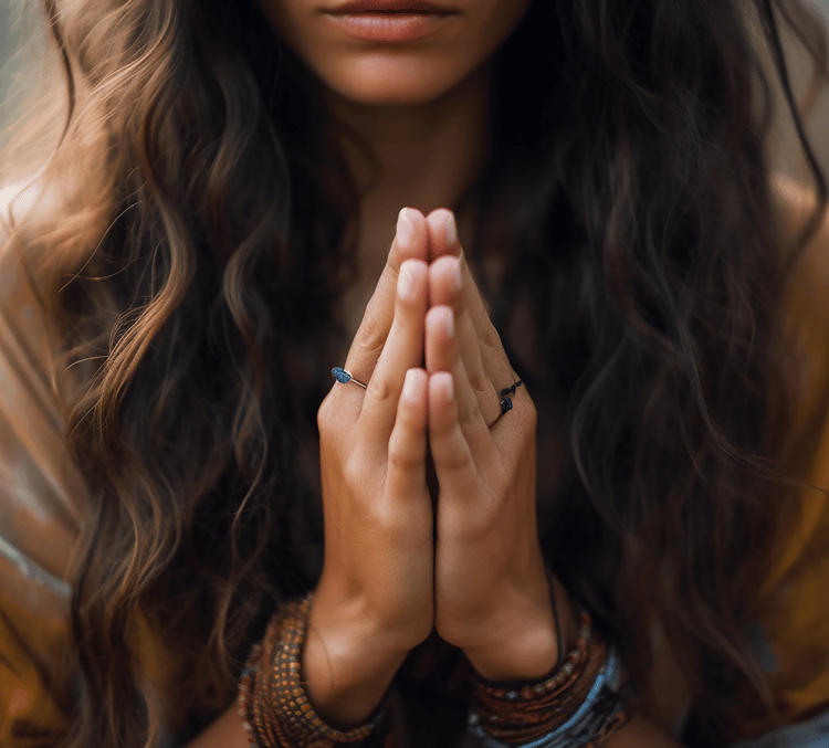woman with hands in prayer pose